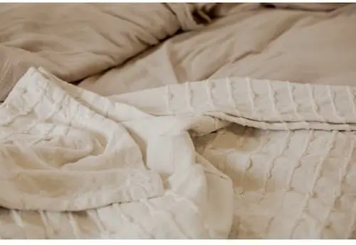 Does an electric blanket go under a best sale mattress protector